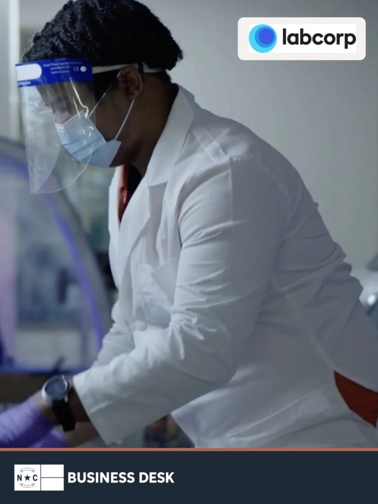 Labcorp laboratory professional working with testing equipment, with the official Labcorp logo and NC Business Desk footer.
