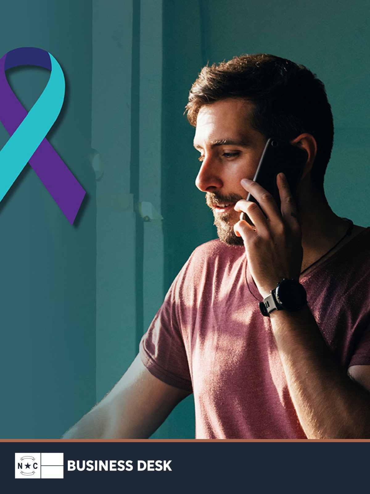 Official NCDHHS crisis-services file image of a man using a phone beside a suicide-prevention ribbon; stock photo posed by a model.