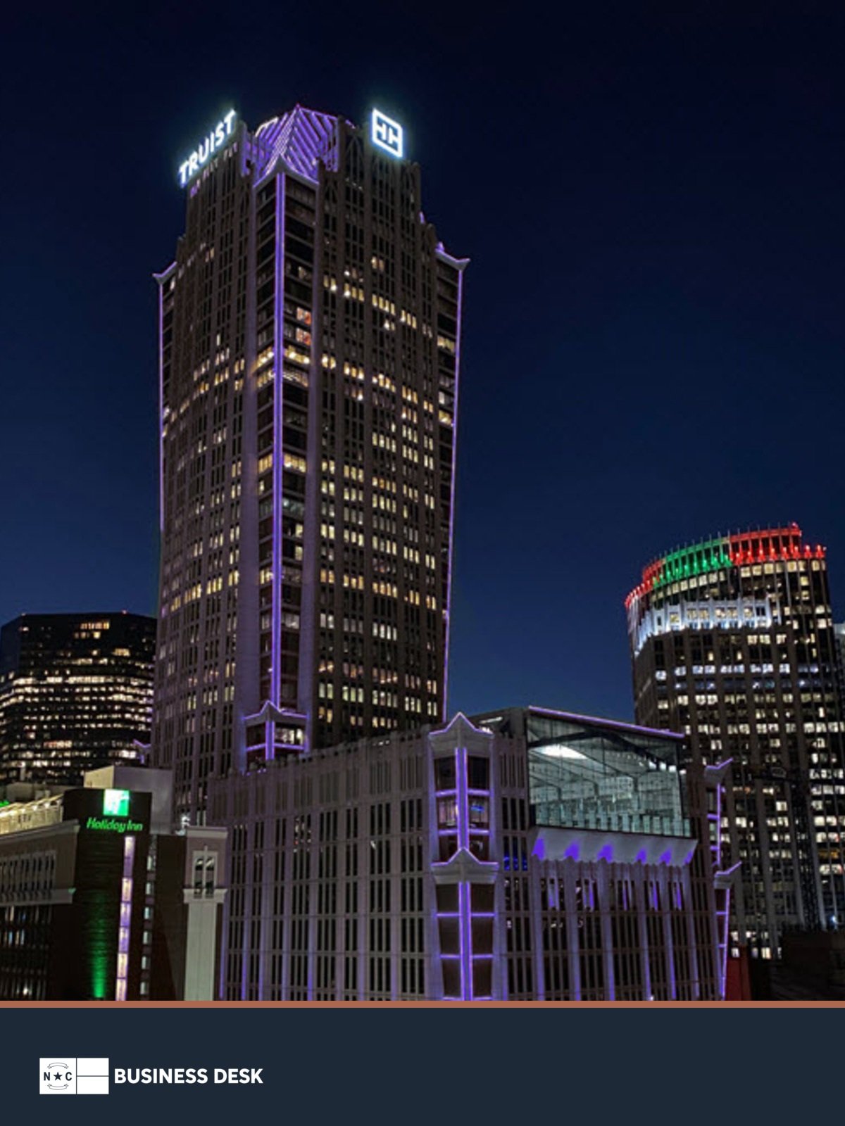 Truist Center in Charlotte at night above the NC Business Desk footer.
