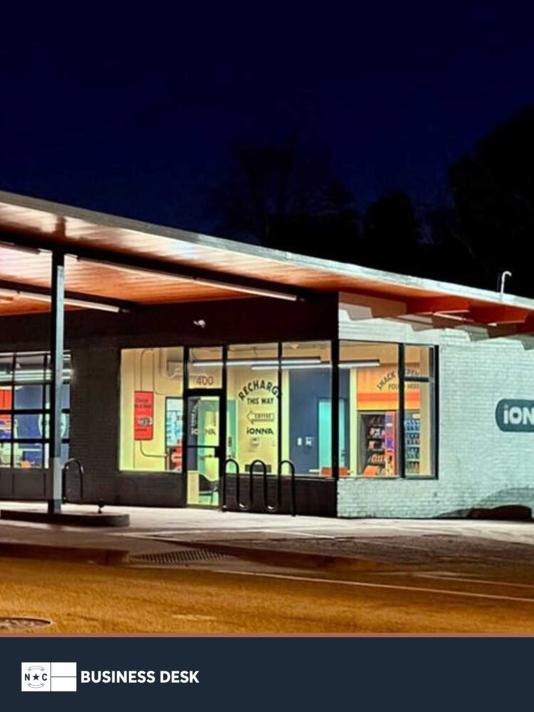 IONNA’s Apex, North Carolina, EV fast-charging station illuminated at night above the NC Business Desk footer.