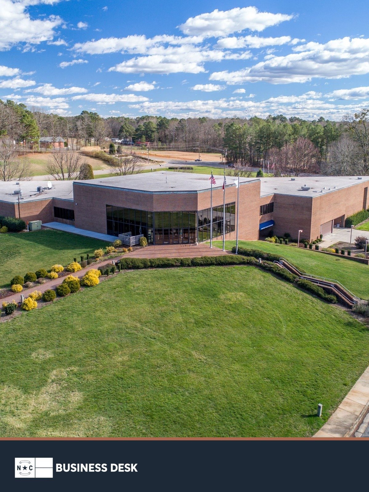 Aerial view of Sanford Municipal Center above the NC Business Desk footer.