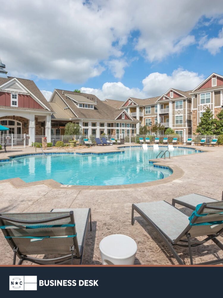 Pavilion Village apartment community in Charlotte, photographed from the pool area.