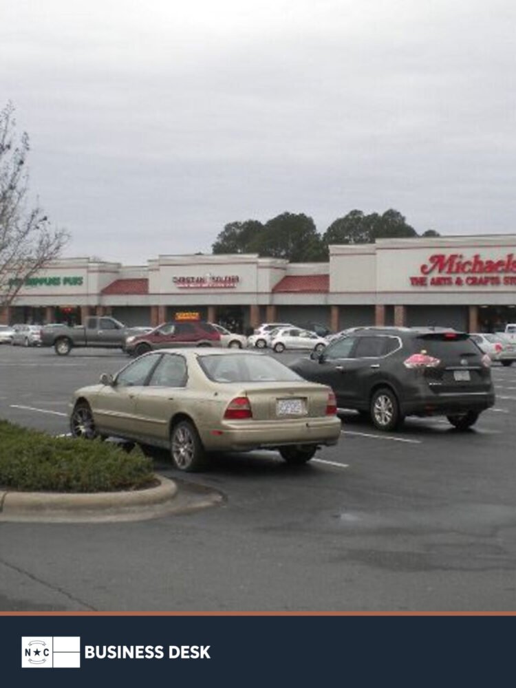 Crossroads Plaza shopping center in Goldsboro, with the Michaels storefront visible.