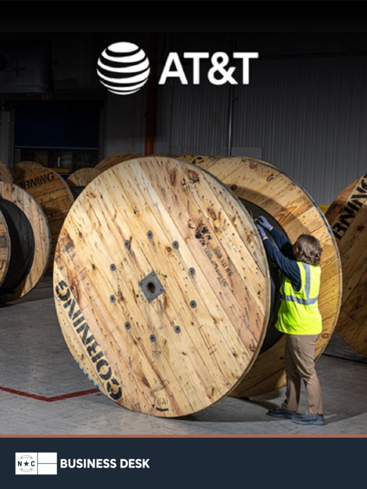 Fiber-optic cable reels in the official image for AT&T's agreement with Corning.