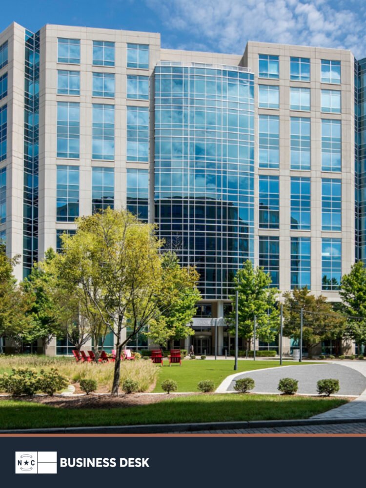 Exterior of the Boyle Building in Ballantyne, the new North American headquarters of Daimler Truck Financial Services, above the NC Business Desk footer.