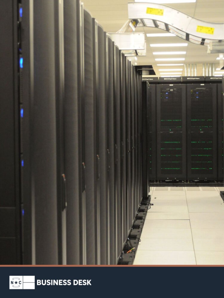 Rows of server cabinets inside the NERSC data center, used as representative data-center infrastructure.