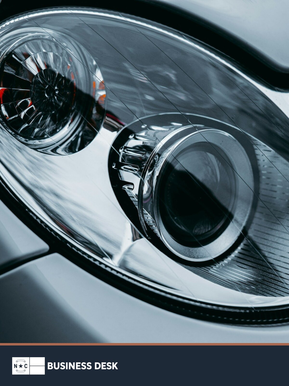 Close-up of a modern automotive headlight assembly, used as contextual imagery for Xingyu's planned Rowan County automotive-lighting plant.