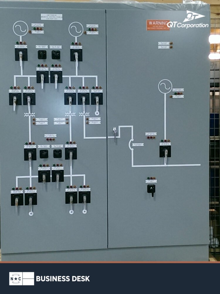 QT Corporation power-control switchgear in a manufacturing setting.
