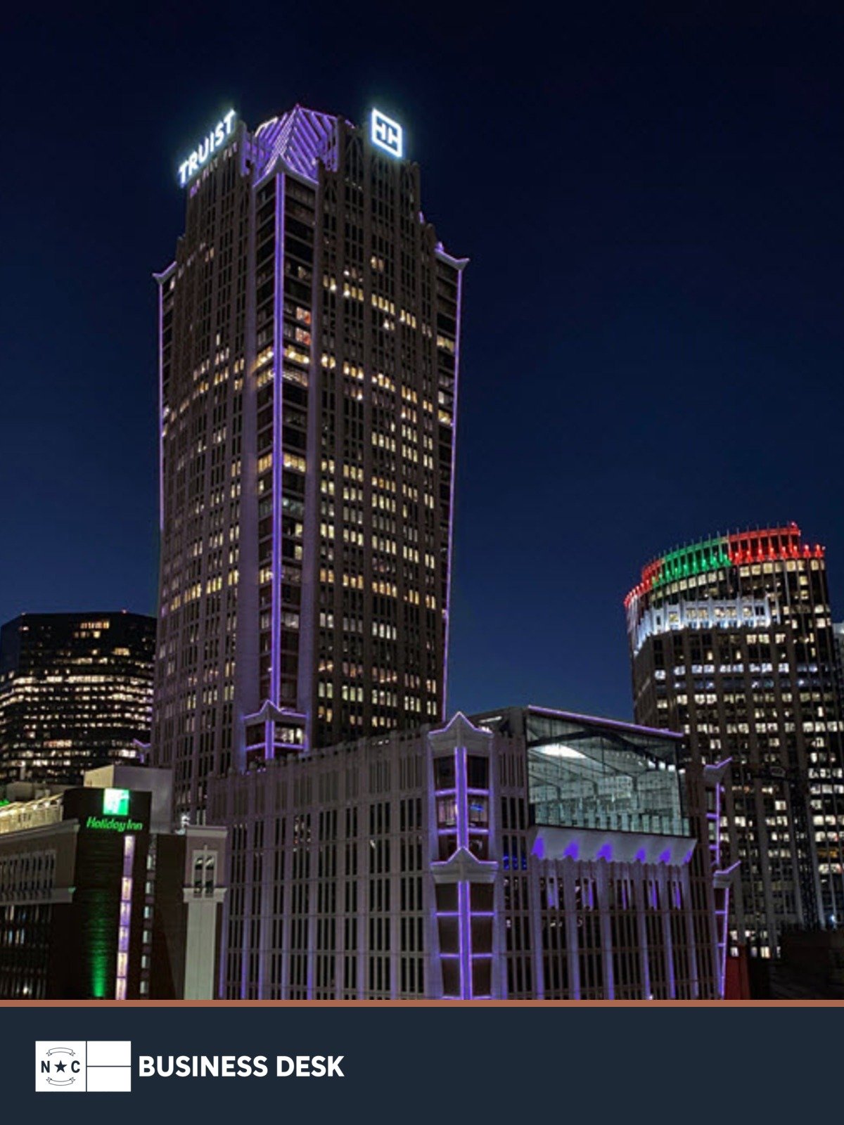 Truist Center in Charlotte at night above the NC Business Desk footer.