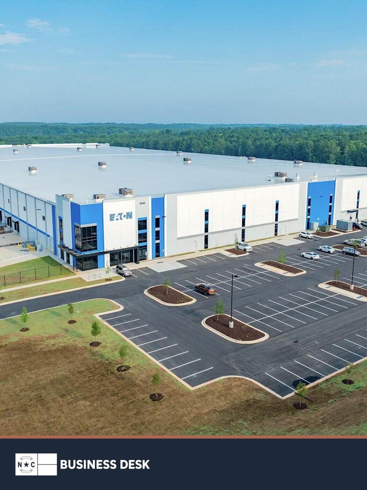 Aerial view of the Eaton Logistics Facility in Youngsville above the NC Business Desk footer.