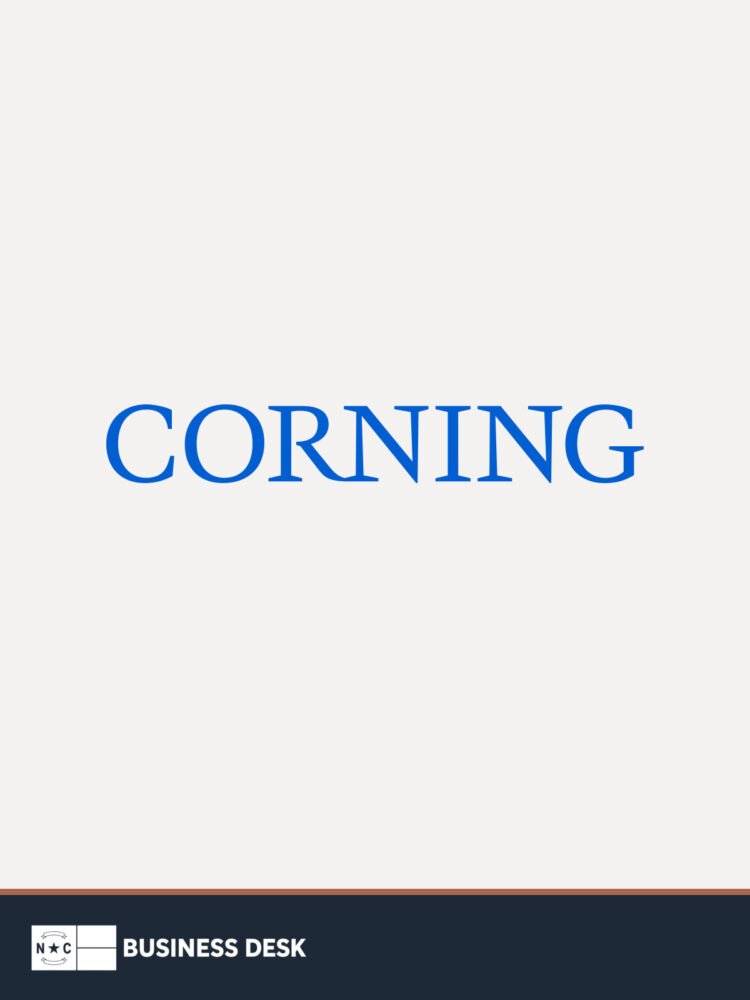The official Corning Incorporated logo on a warm-white field above the NC Business Desk footer.